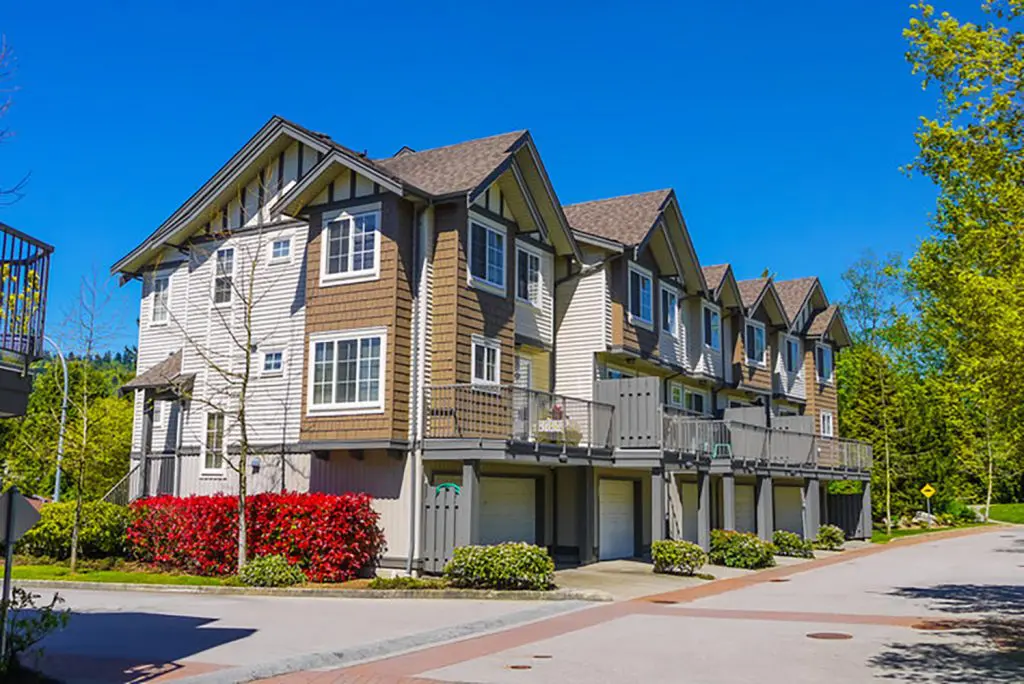 Row of modern townhomes in Arlington illustrating how buyers decide between condos and townhomes based on layout and location