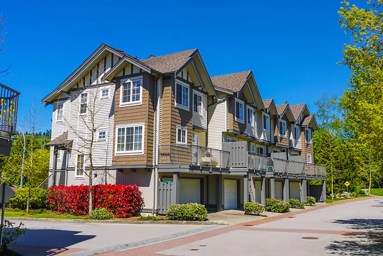 Row of modern townhomes in Arlington illustrating how buyers decide between condos and townhomes based on layout and location